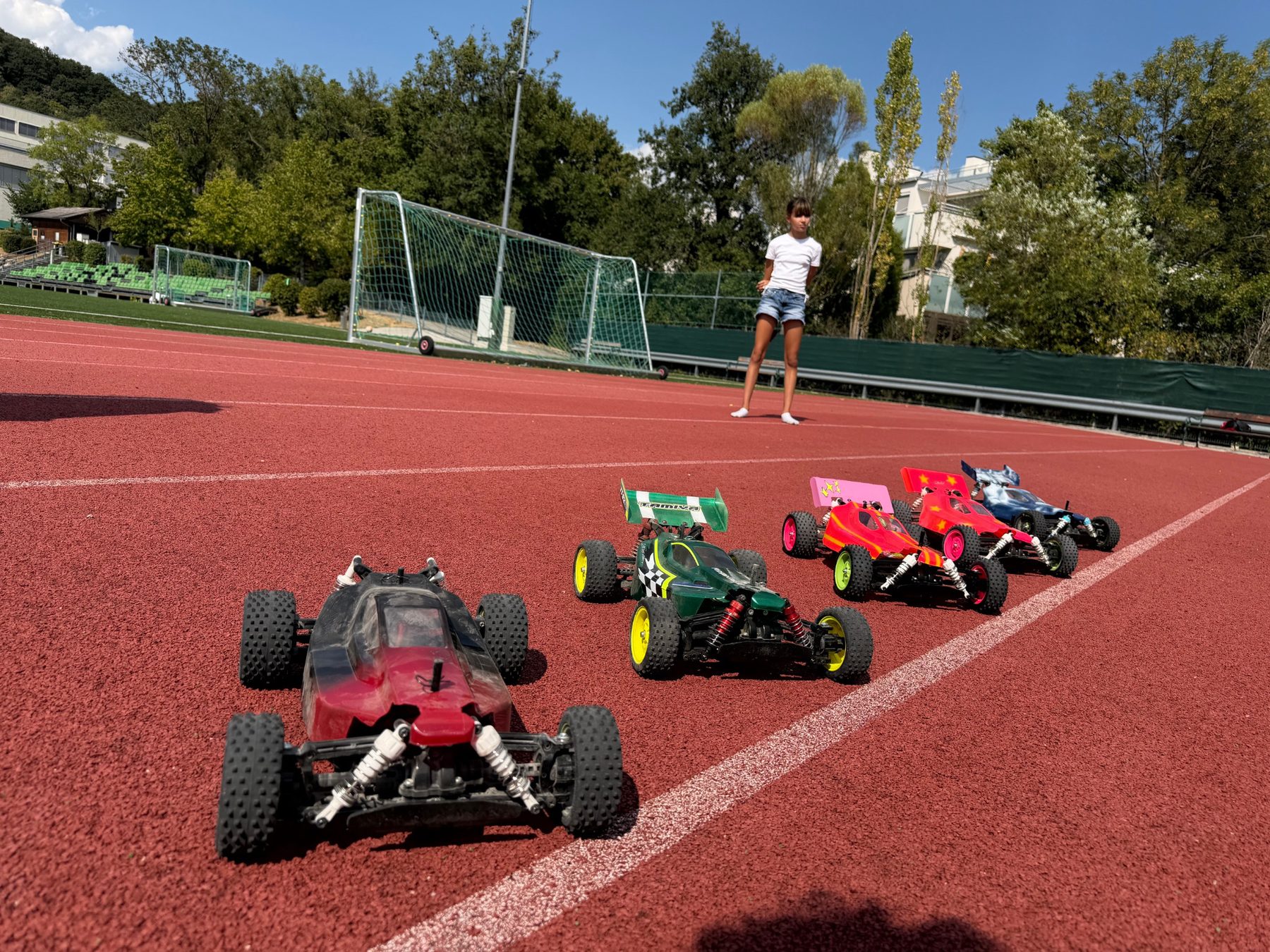 RC Garage Summer Camp participants driving Tamiya RC buggies outdoors in Vienna